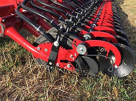 Easy adjustment handle for quick and precise setting of seed depth.